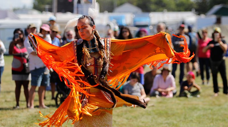 Josée of Pikwàkanagàn First Nation performs the Fancy Shall dance, which emulates the butterfly